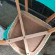Set of 4 vintage chairs in wood and imitation blue leather dating from the 50s. Wooden structure. Seat and backrest in imitation leather 2 mint green and 2 yellow. Seating dimension: 46 cm. Good state of conservation, some traces of wear.