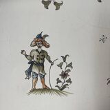 Large earthenware dish from Moustiers, signed Féret