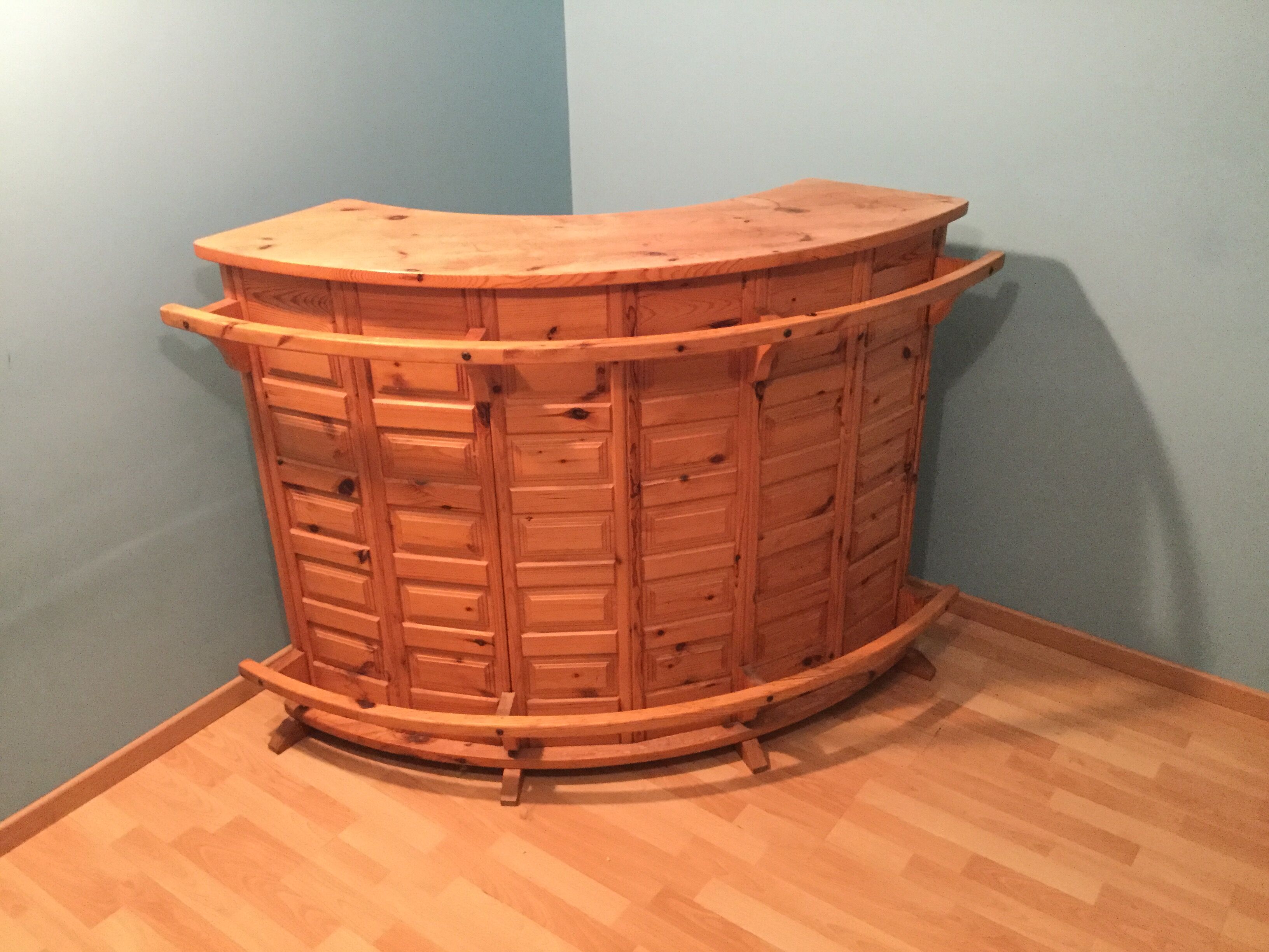 Vintage bar counter with natural wood stools