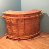 Vintage bar counter with natural wood stools