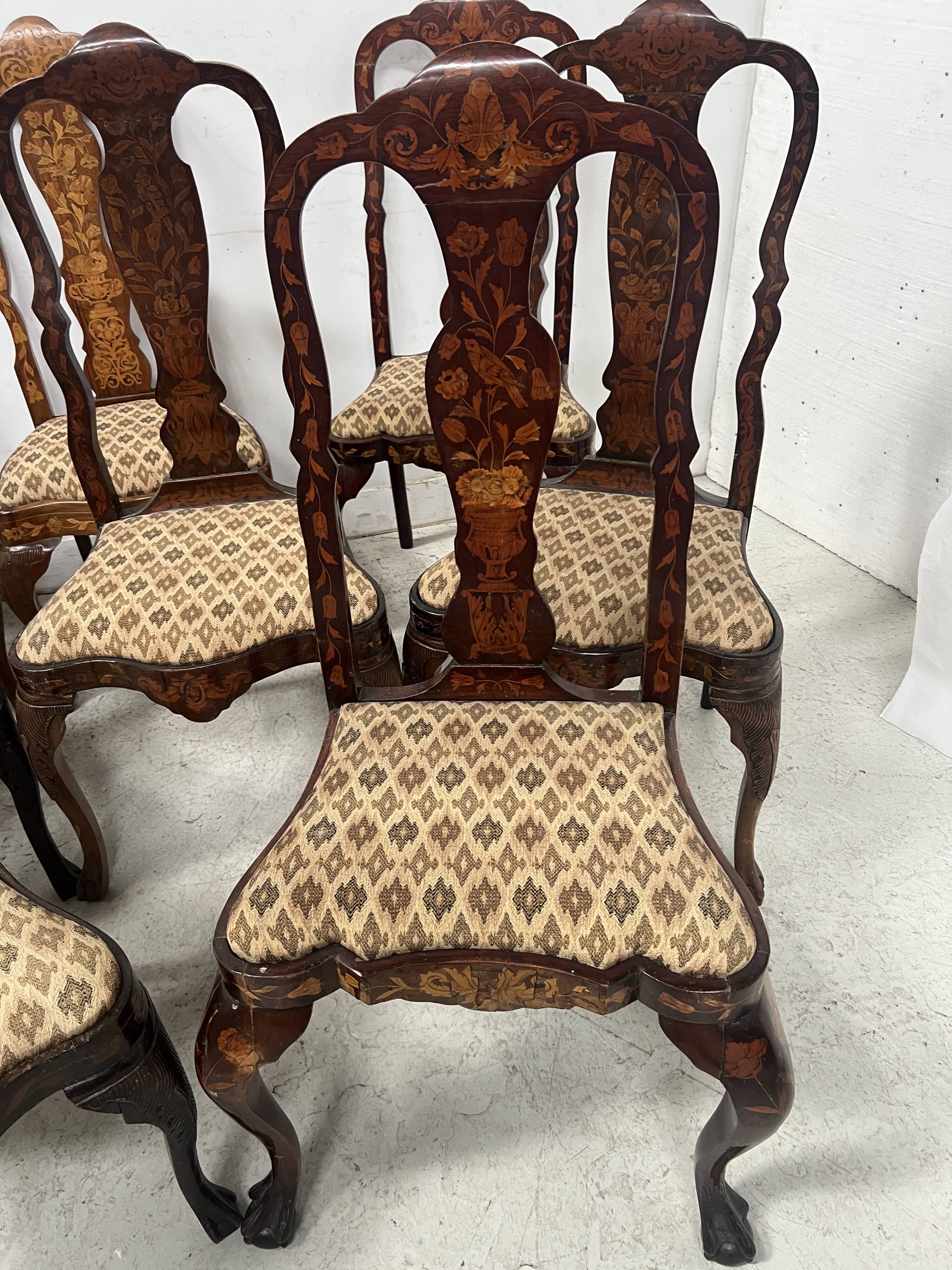 Set of eight Dutch marquetry chairs from the 19th century.