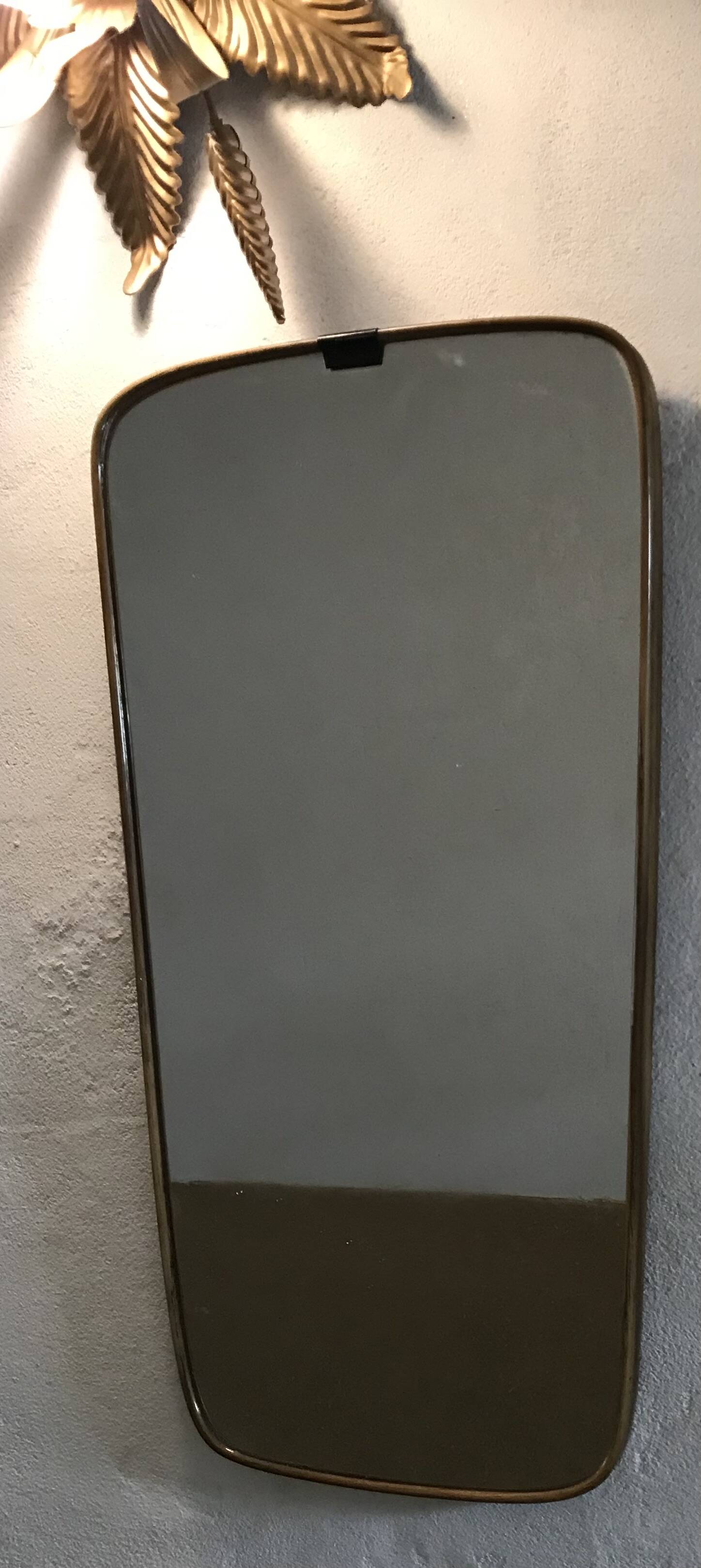 Vintage 1960 free-form mirror known as a rear-view mirror.
