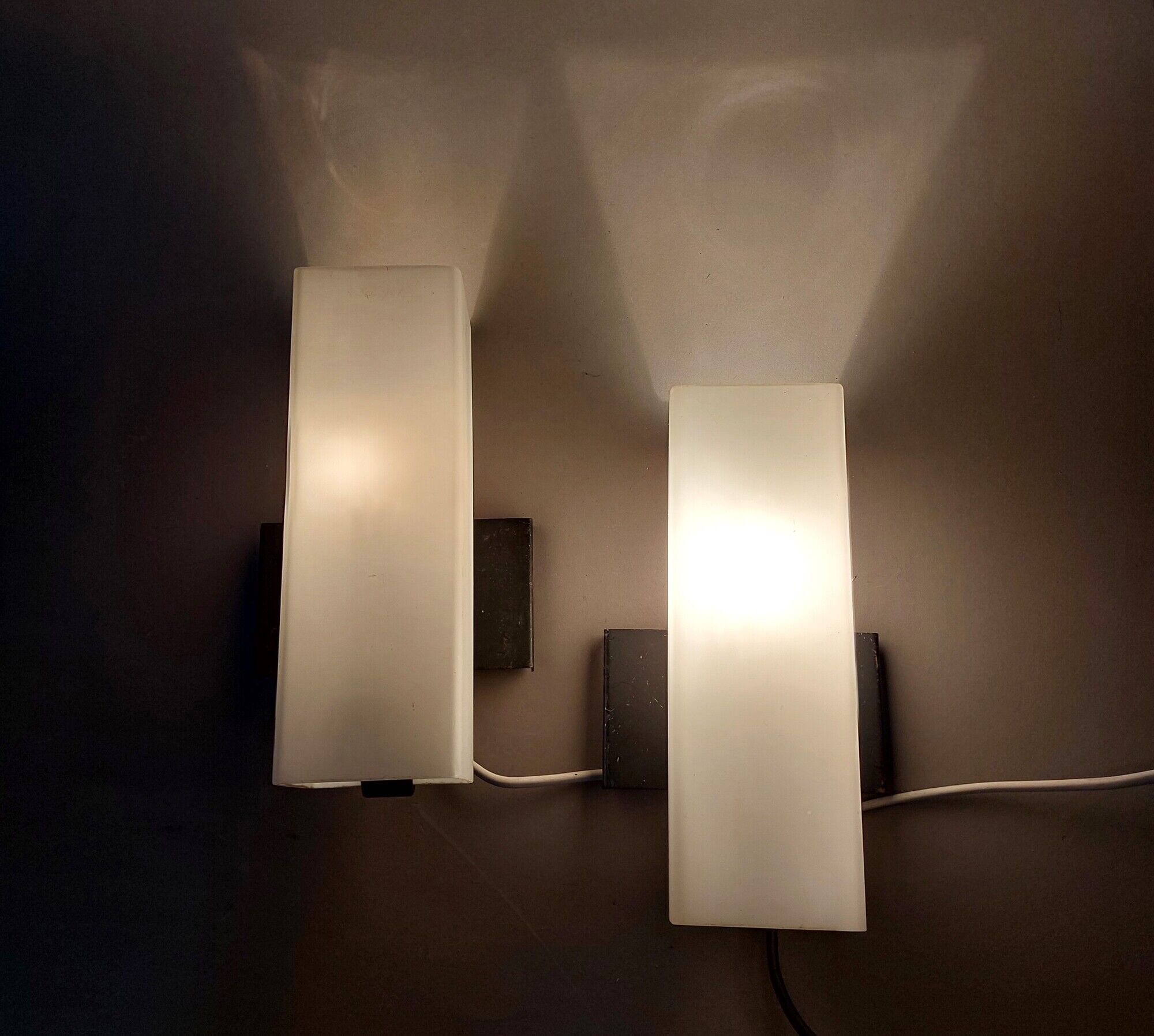 Pair of modernist sconces in black metal and white opaline vintage