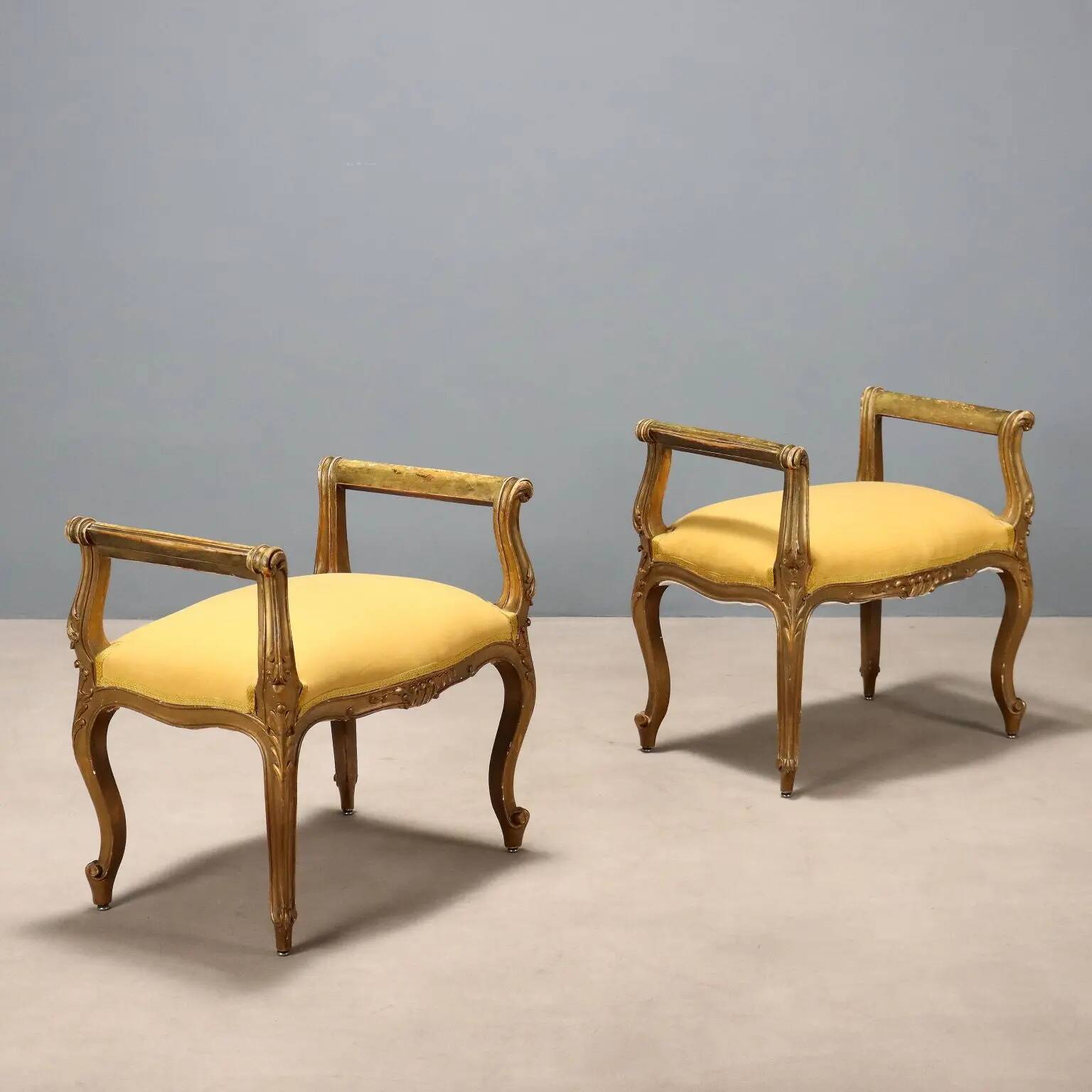 Pair of antique baroque-style benches in carved wood, Italy, 20th century.