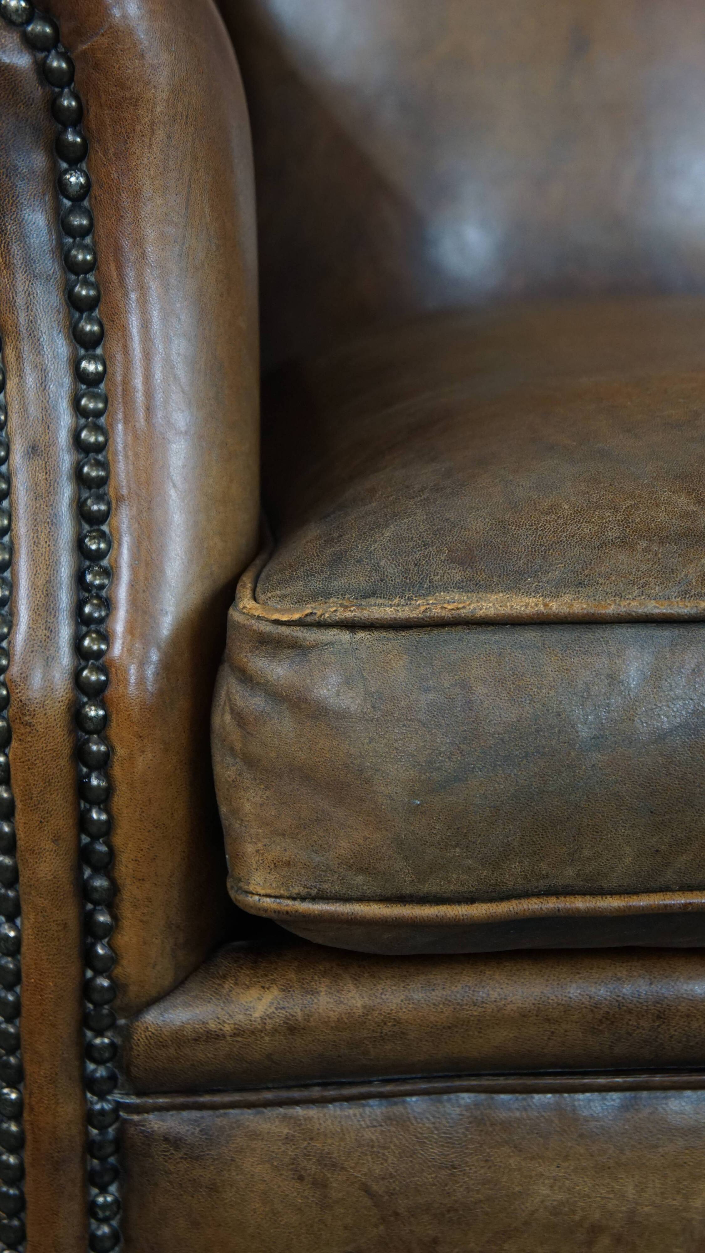 Sheep leather wingback chair with patina