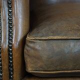 Sheep leather wingback chair with patina