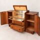 Art Deco walnut bar cabinet with a mirrored interior.