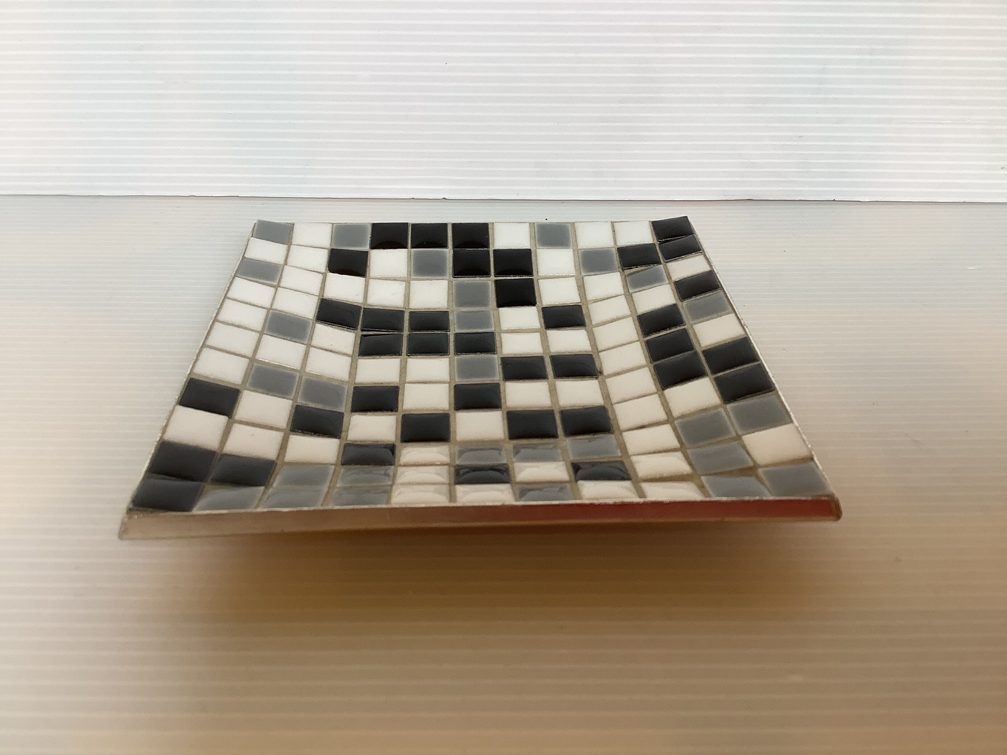 Mosaic grey, white, and black catch-all tray.