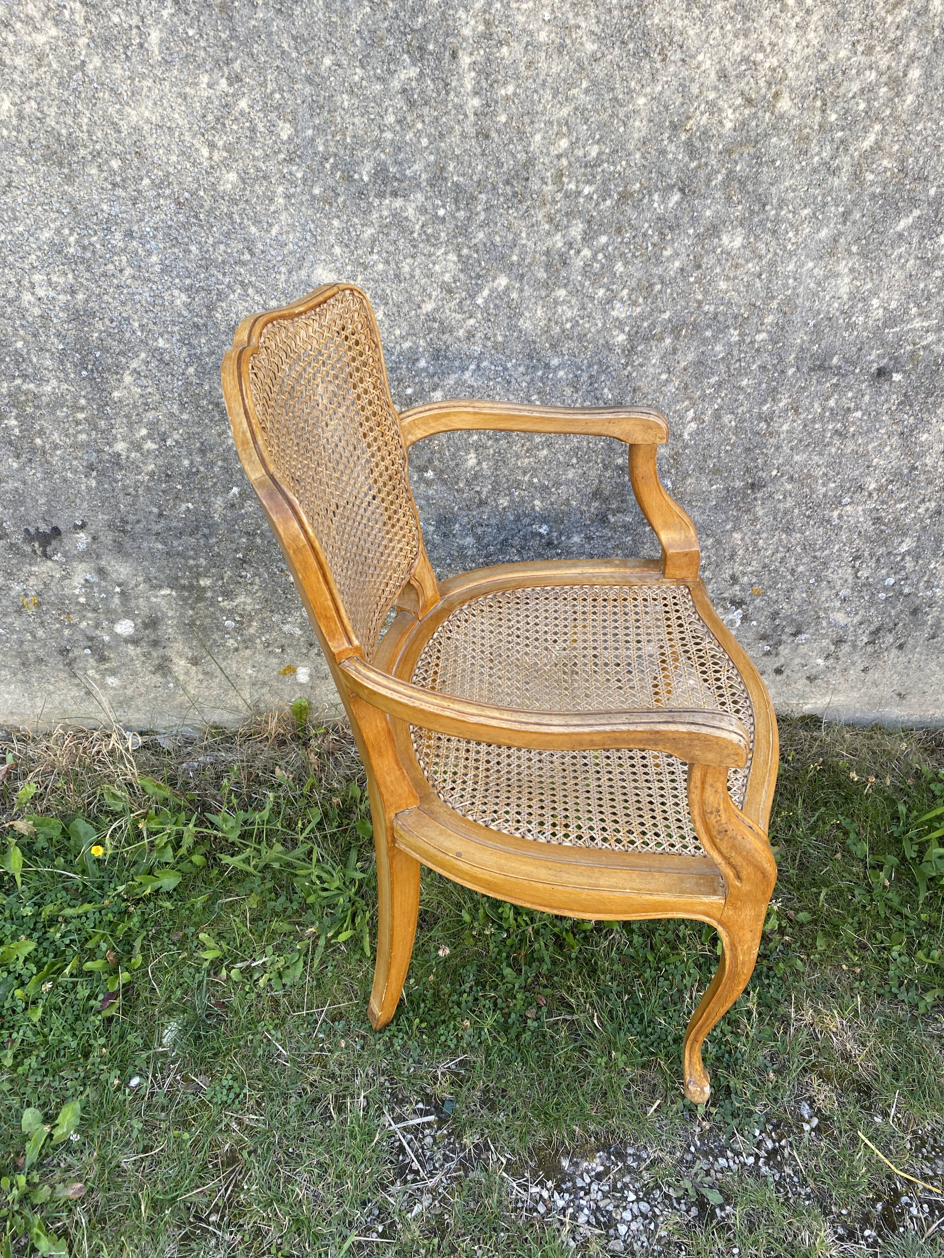 Cane armchair