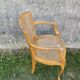 Cane armchair