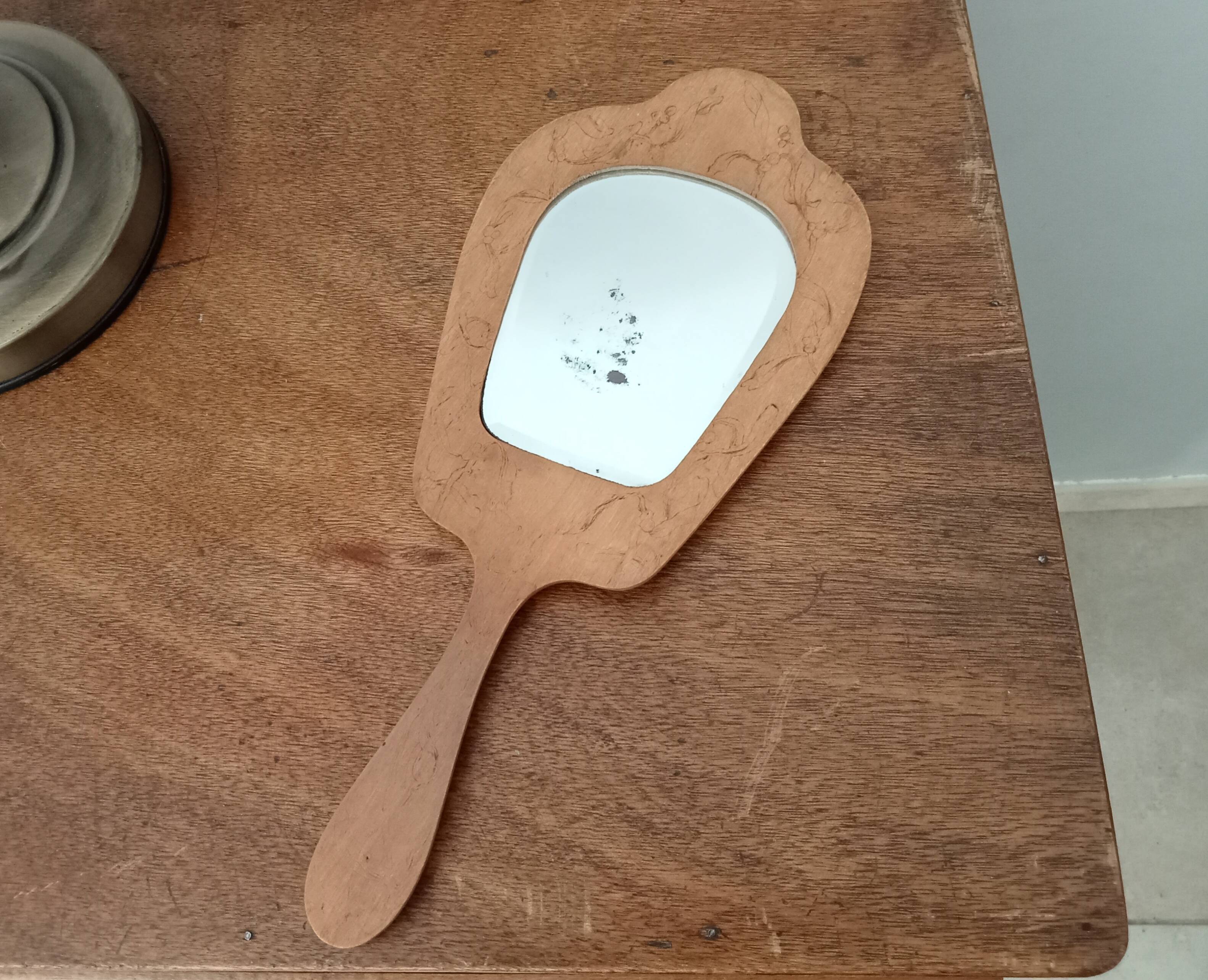 Antique beveled hand mirror