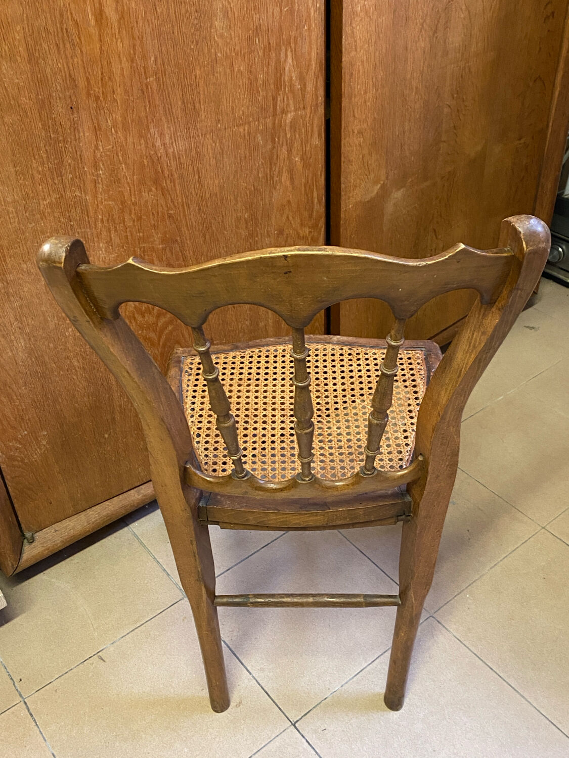 Antique wooden chair, cane seat