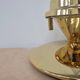 Pair of Hollywood Regency table lamps in brass with glass shades.