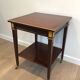 Mahogany and brass table signed Hugnet.