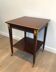 Mahogany and brass table signed Hugnet.