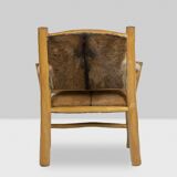Brutalist style armchair in elm and goatskin, 1970s