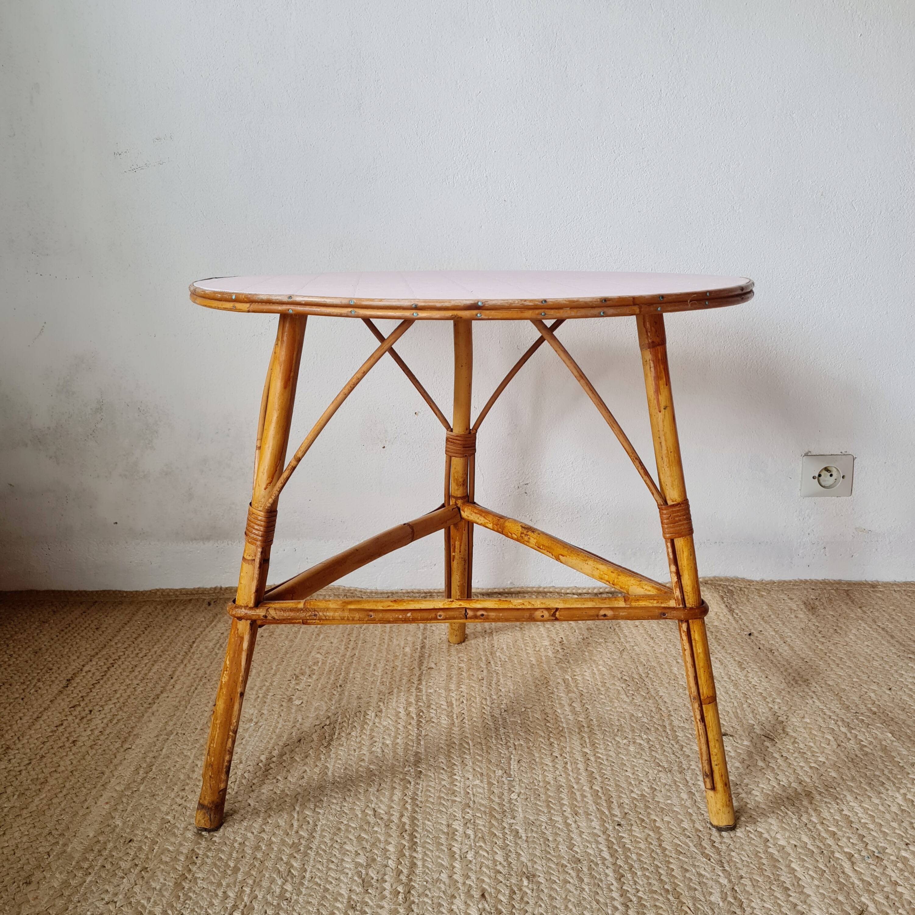Round soft pink rattan table