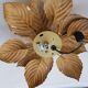 Golden metal flower sconce