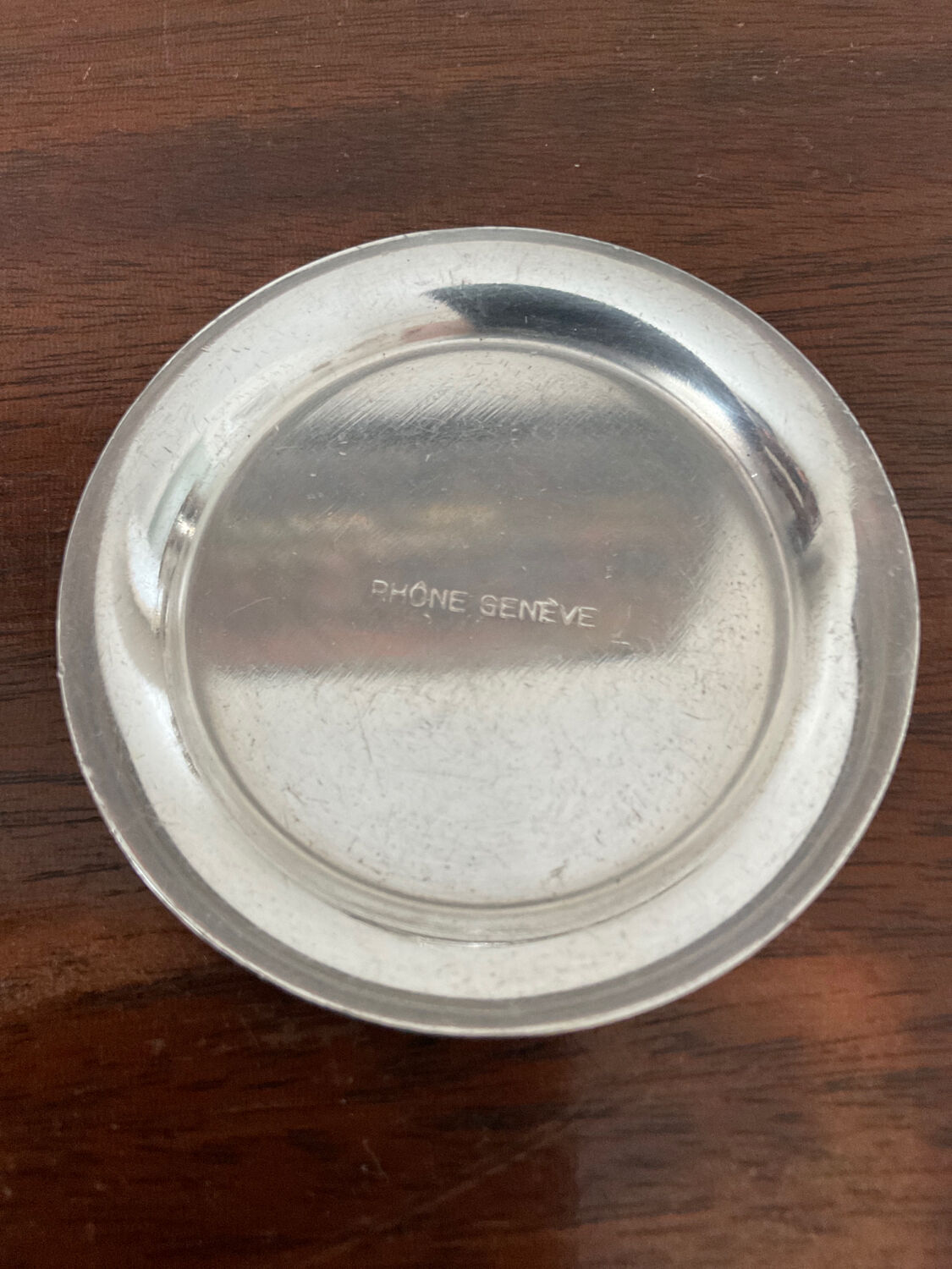Cup and silver metal saucer