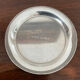 Cup and silver metal saucer