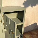 Asymmetrical vintage wardrobe painted in green.