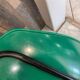 A shell chair by Pierre Guariche for Meurop in vintage green from the 1960s.