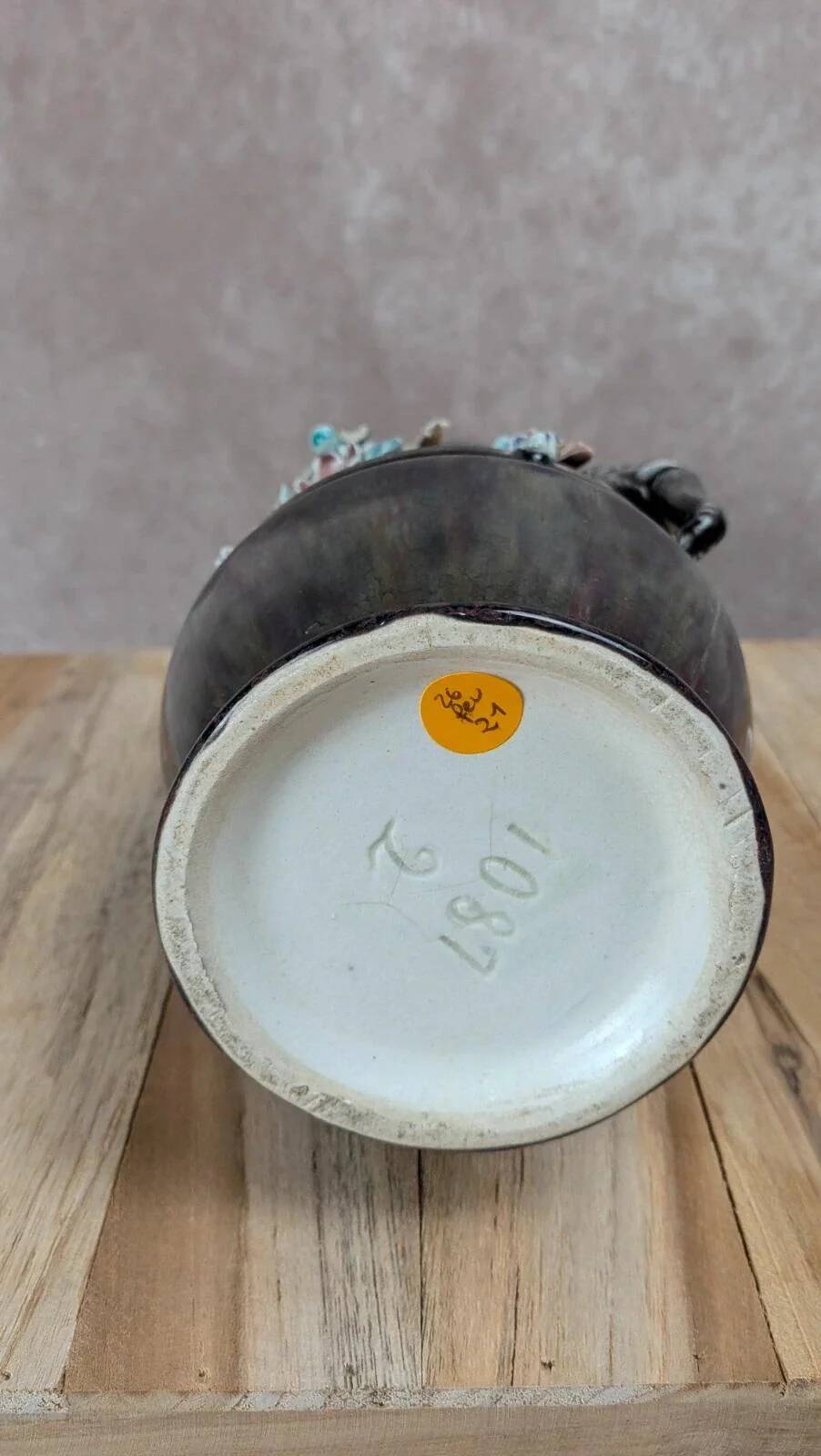Antique vase in slipware with elephant and flower decoration.