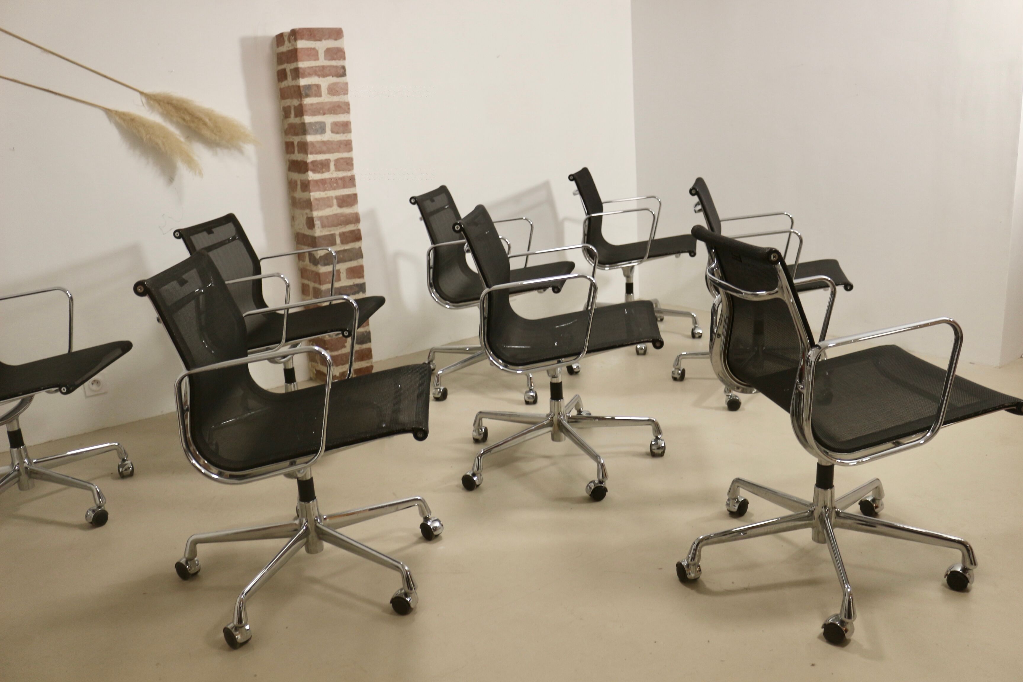 Set of 8 Charles and Ray Eames armchairs by Vitra model EA 117
