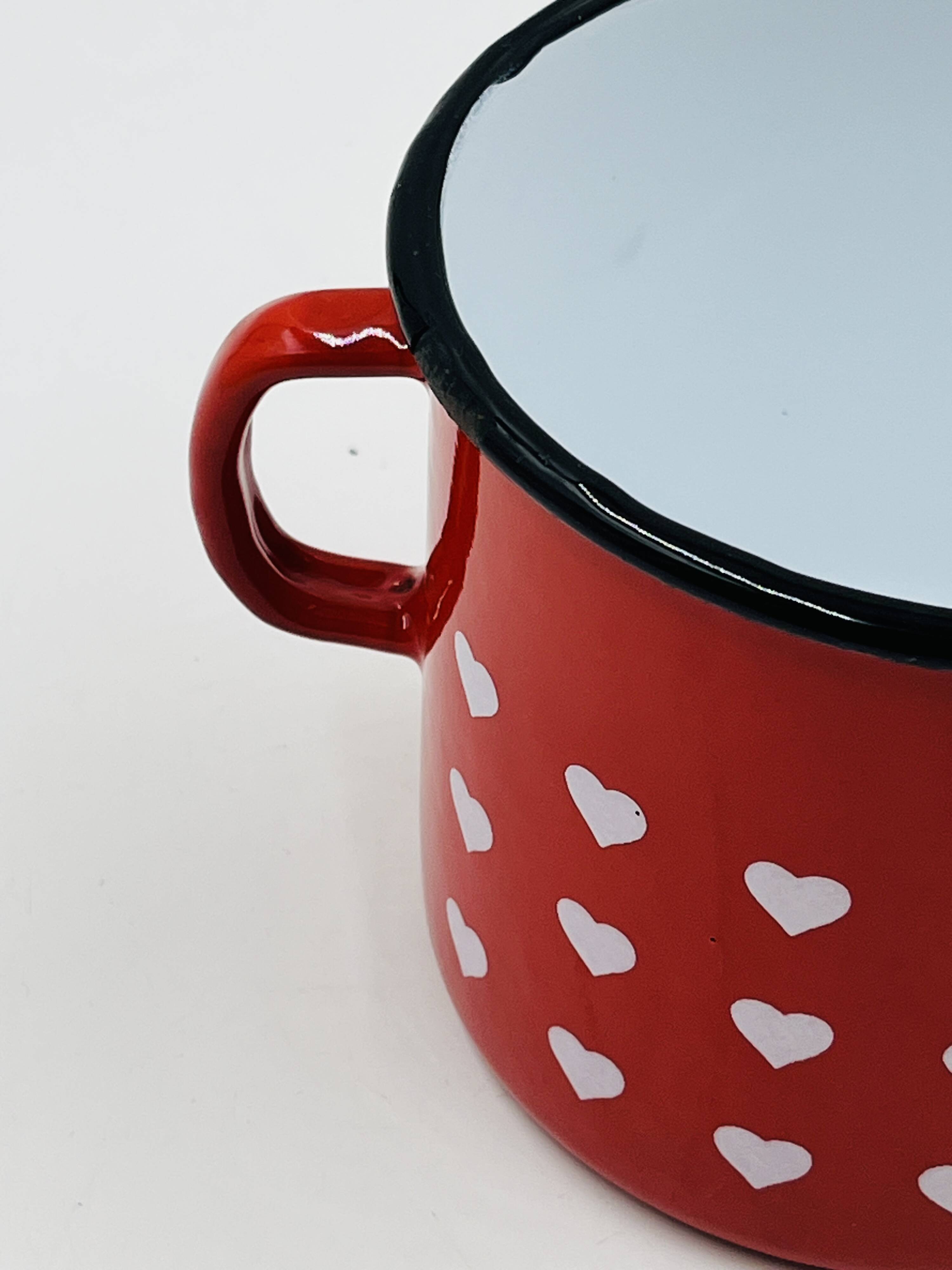 Vintage red enamelled measuring jug with hearts