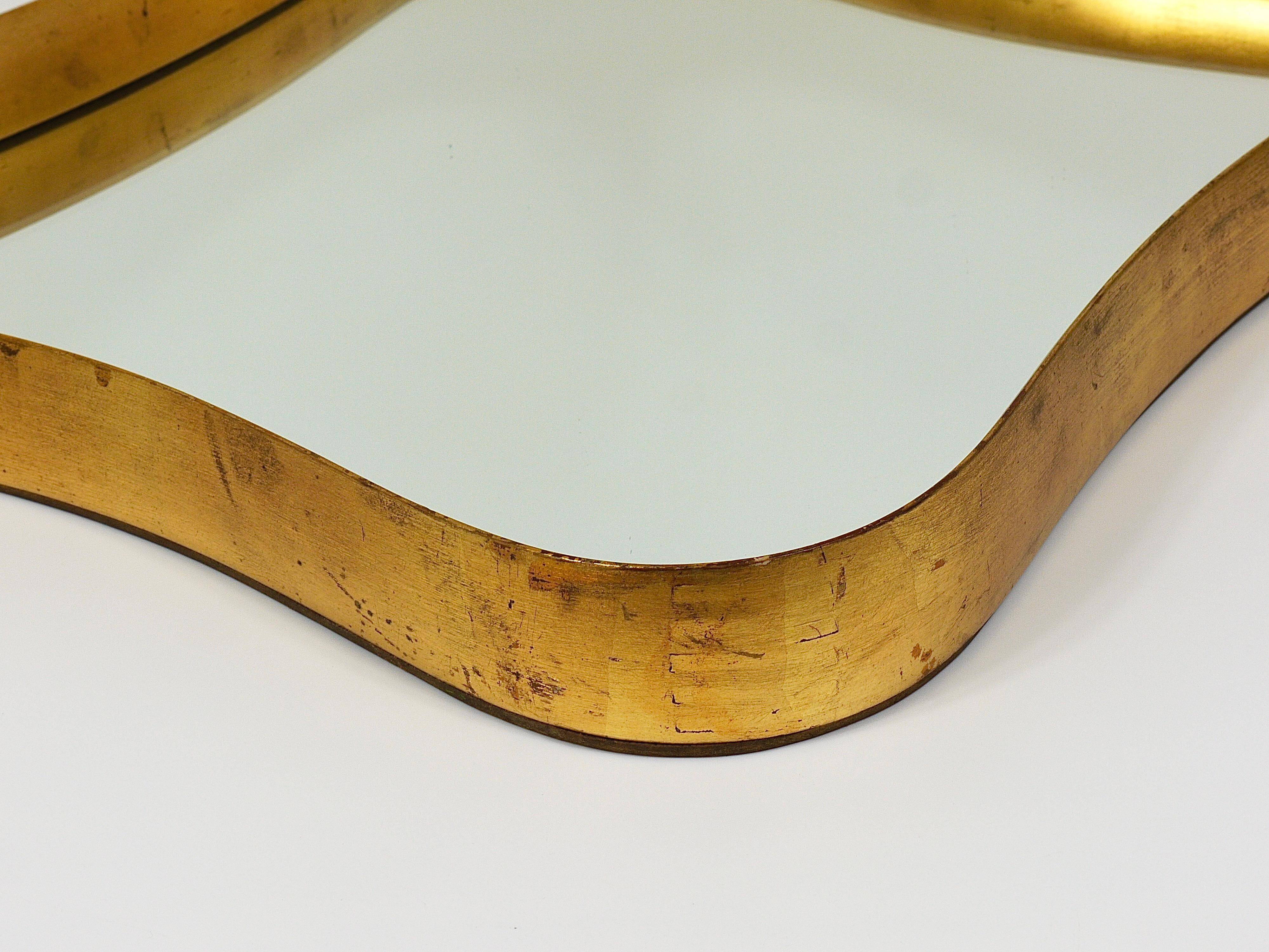 Golden wooden mirror in the style of Gio Ponti by Max Welz, Vienna, Austria, 1940s.