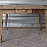 Old farmhouse table with its 2 extensions and raised legs.