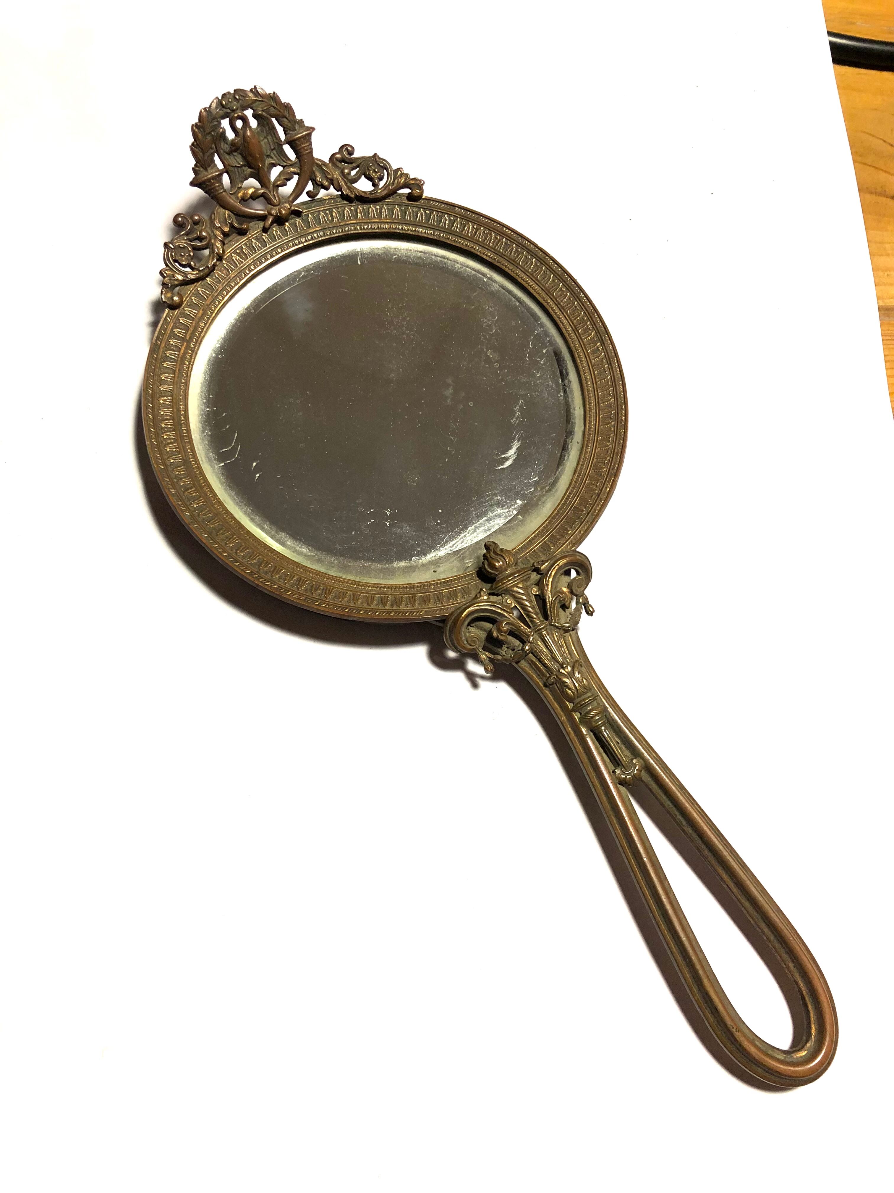 Courtesy hand mirror