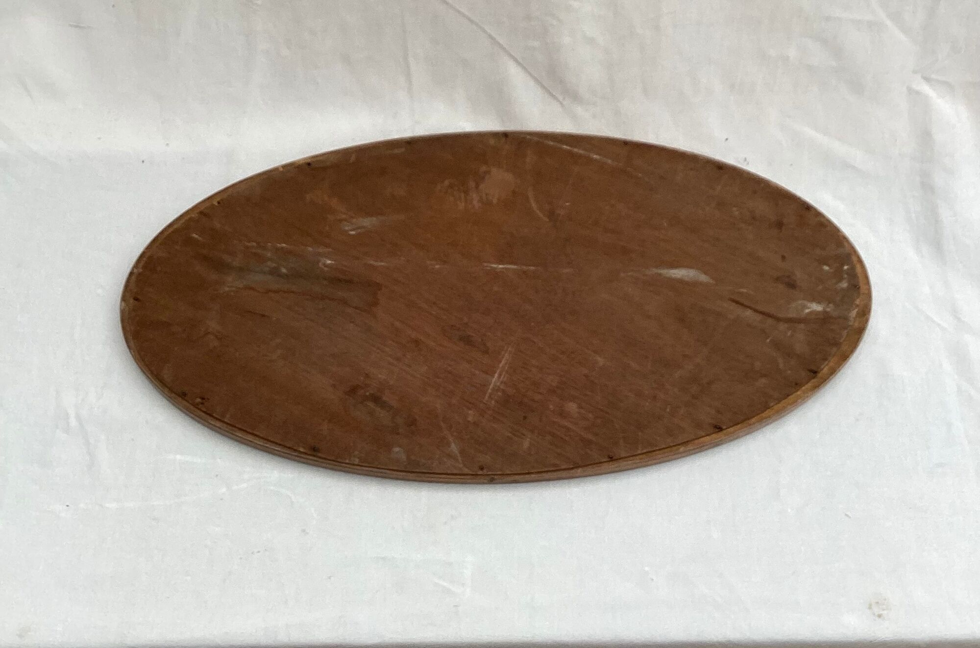 Oval beveled mirror surrounded by light wood dimension: height -74,5cm- width -38,5cm- prof-2cm-