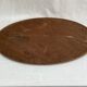 Oval beveled mirror surrounded by light wood dimension: height -74,5cm- width -38,5cm- prof-2cm-