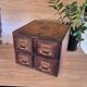 Workshop furniture made of oak and brass.