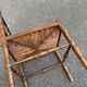 19th-century solid wood corner chair with red and blue rush seating.