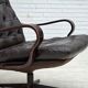 Fauteuil pivotant scandinave des années 1970, en cuir patchwork d'origine.