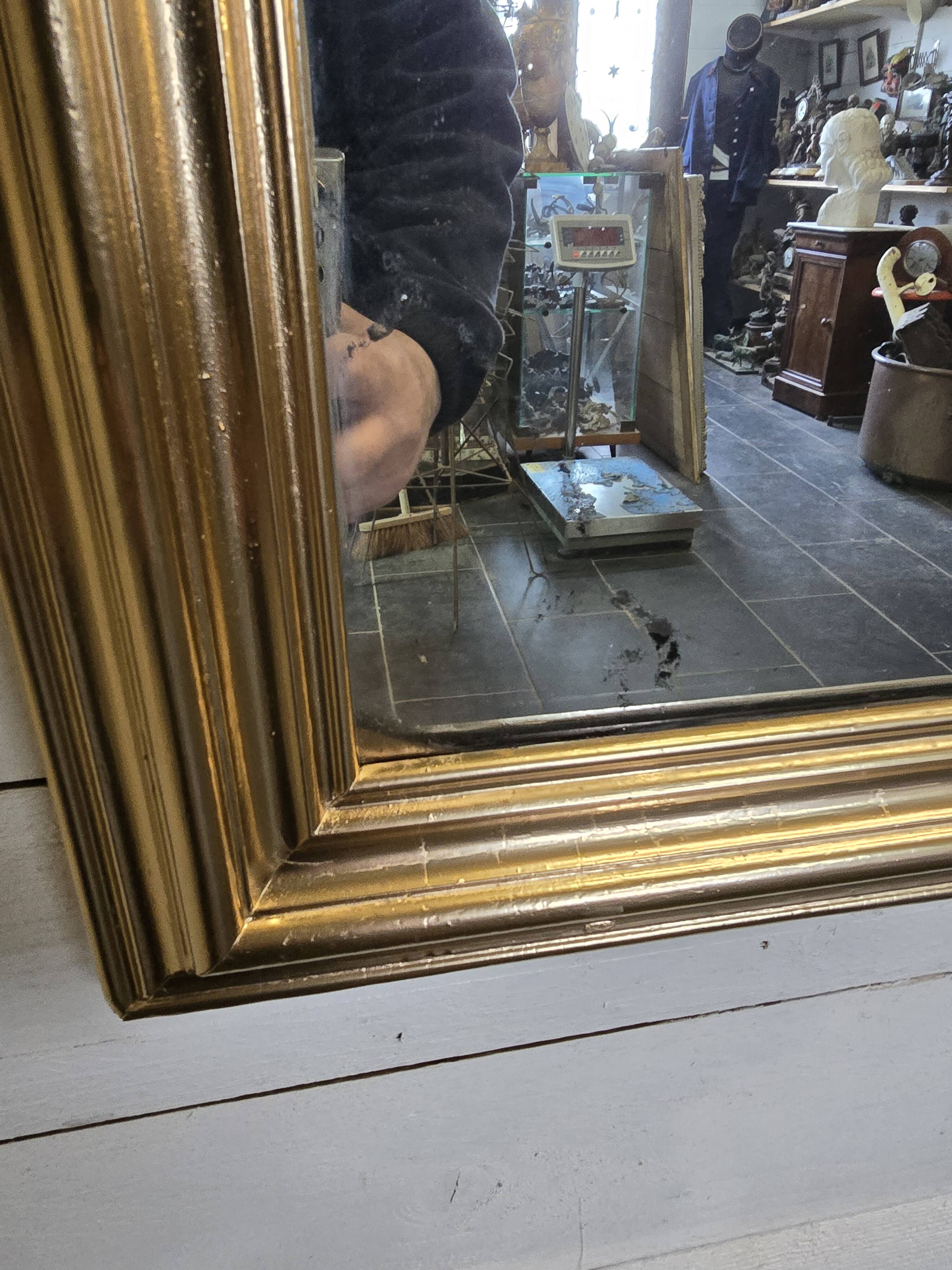 Old Louis Philippe style gilded mirror with mercury mirror