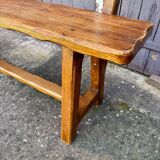 Brutalist bench with dark wood backrest