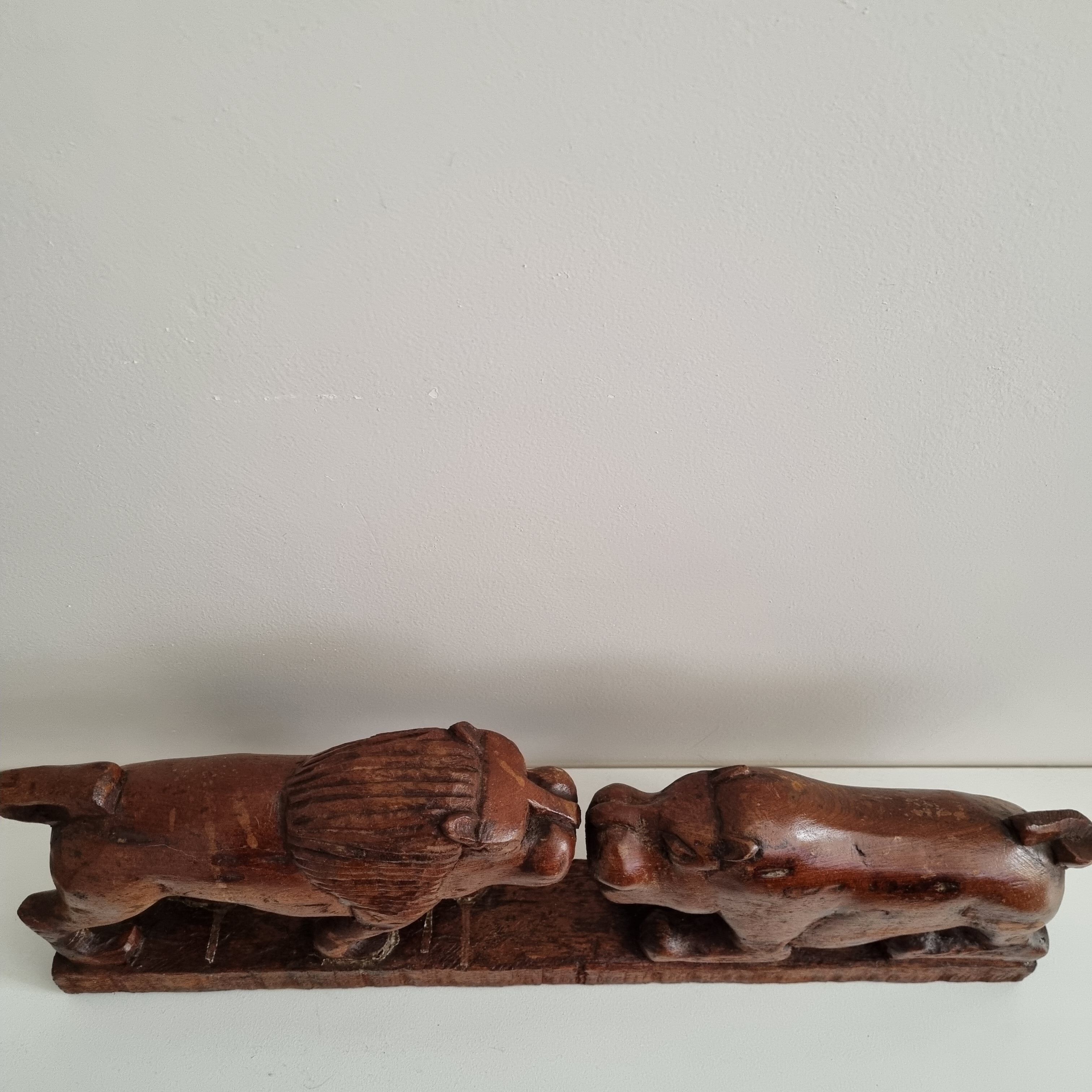 Lion and hippopotamus wood sculpture