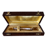 Sugar or ice tongs in their case