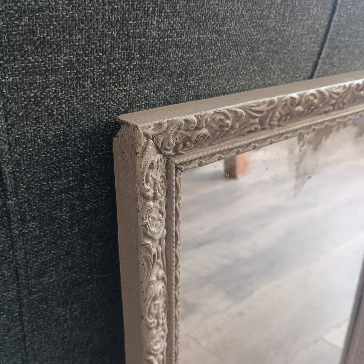 Antique mirror in carved, painted and patinated wood