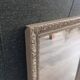 Antique mirror in carved, painted and patinated wood