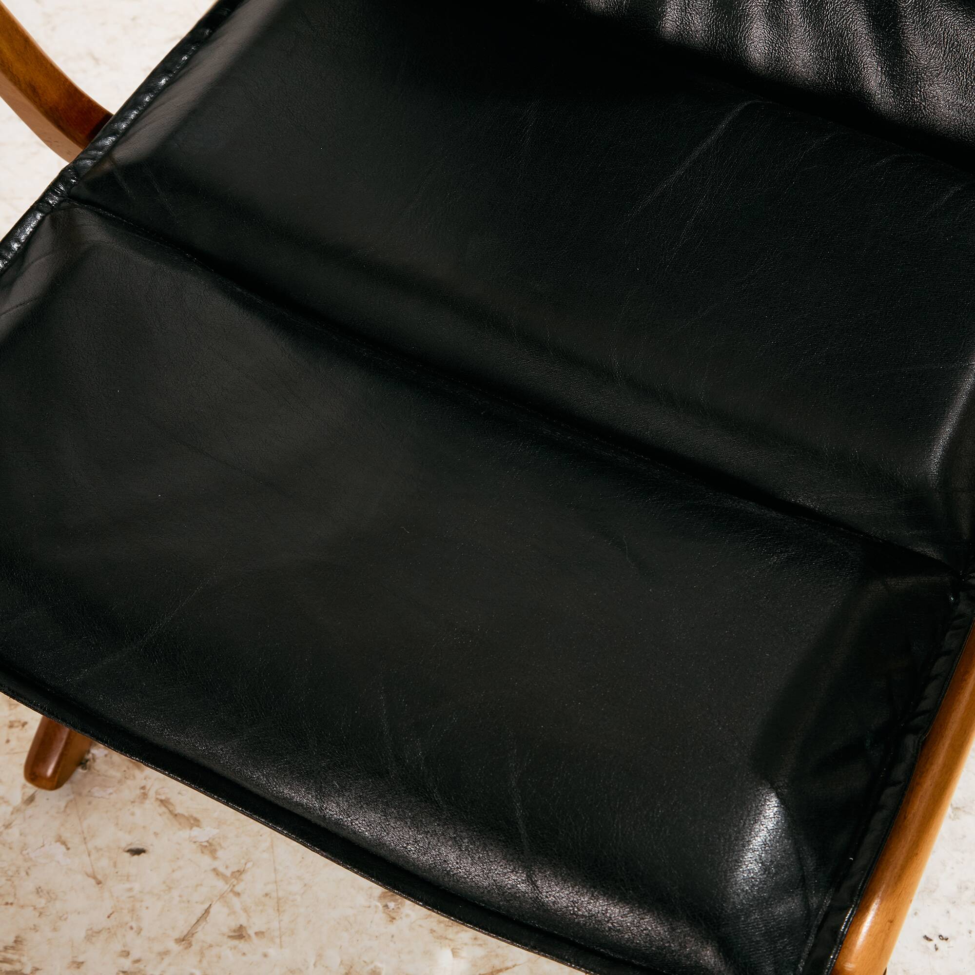 Beech armchair with leather upholstery