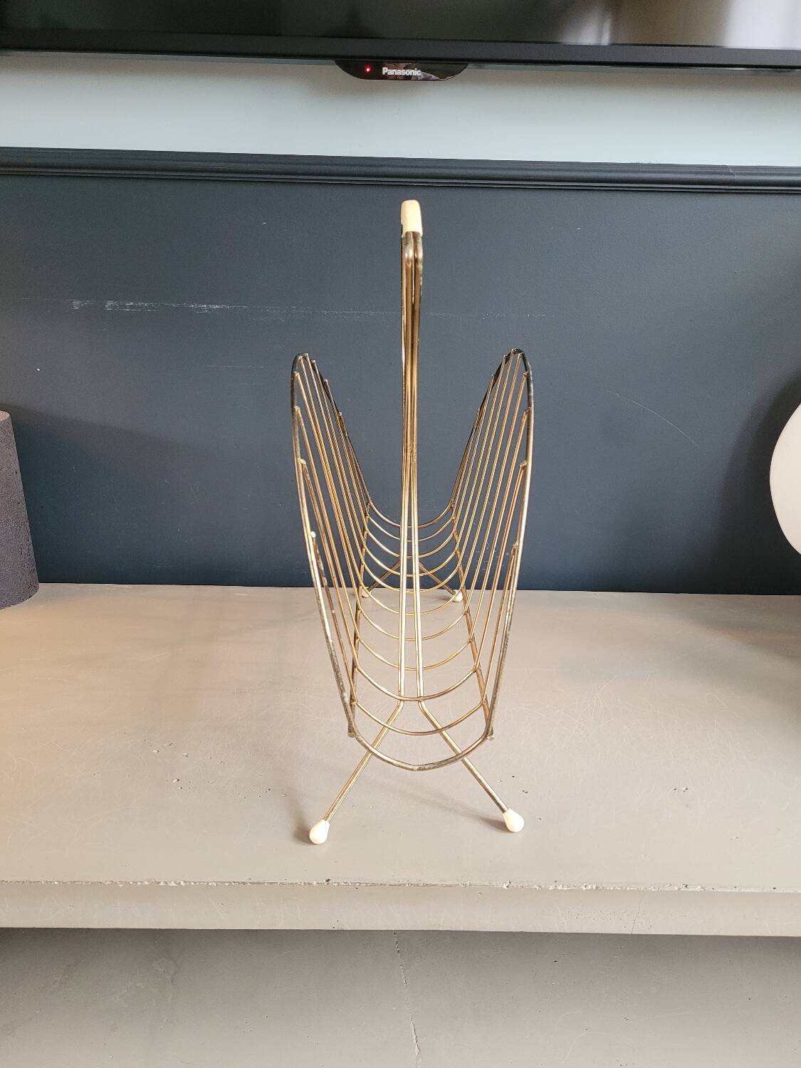 Vintage gold metal magazine rack