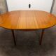 Scandinavian table in round teak with built-in extensions 1960