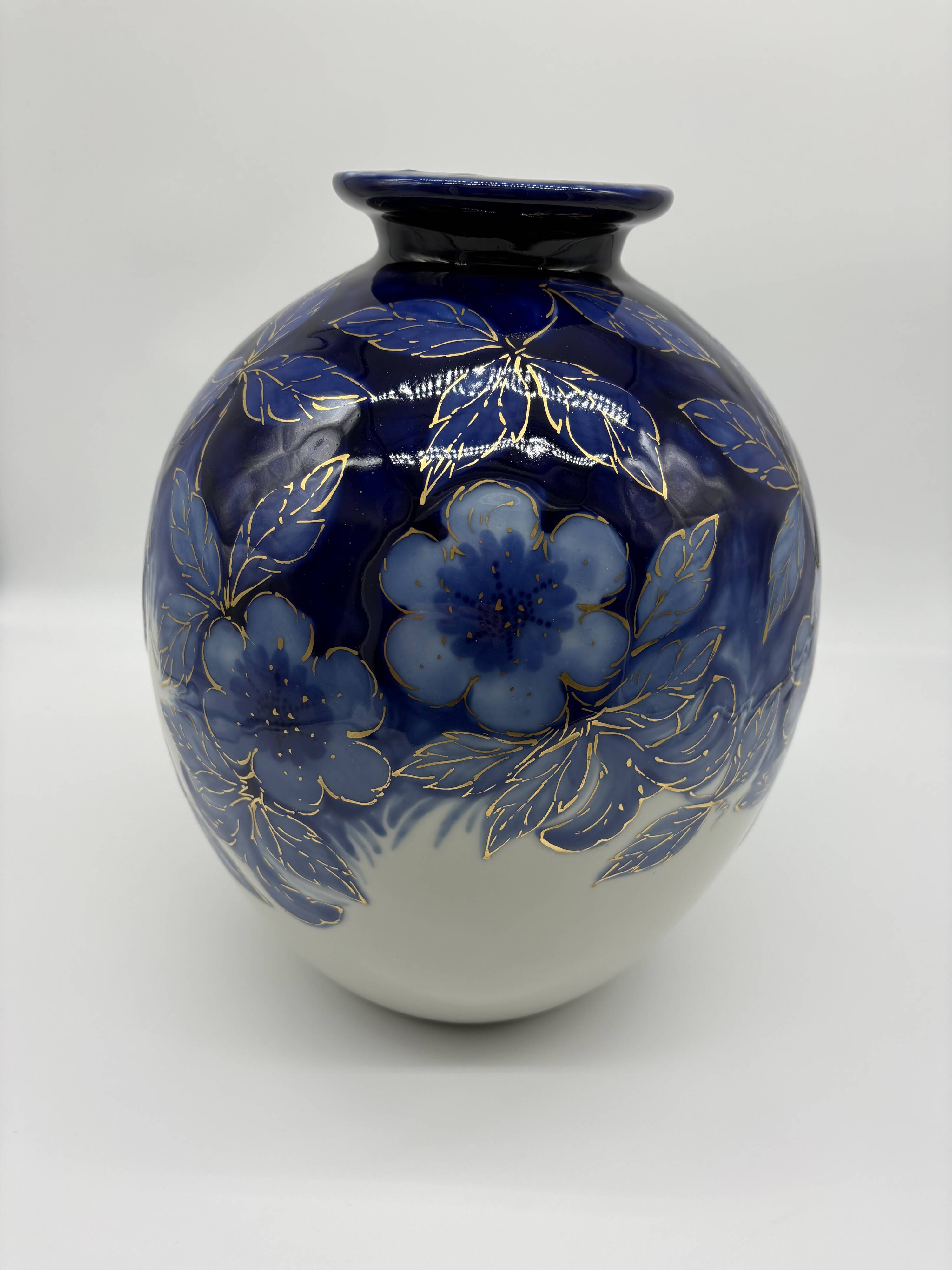 Large Tharaud Limoges vase in cobalt blue porcelain with floral decoration.