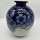 Large Tharaud Limoges vase in cobalt blue porcelain with floral decoration.