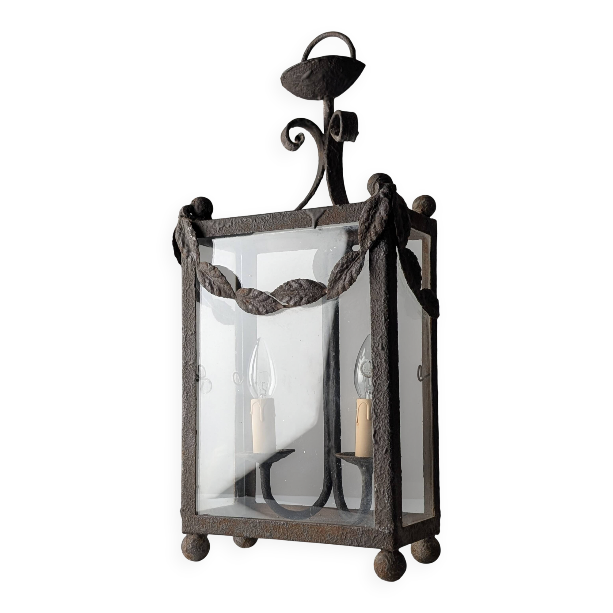 Wrought iron lantern with glass panels, leaf motifs