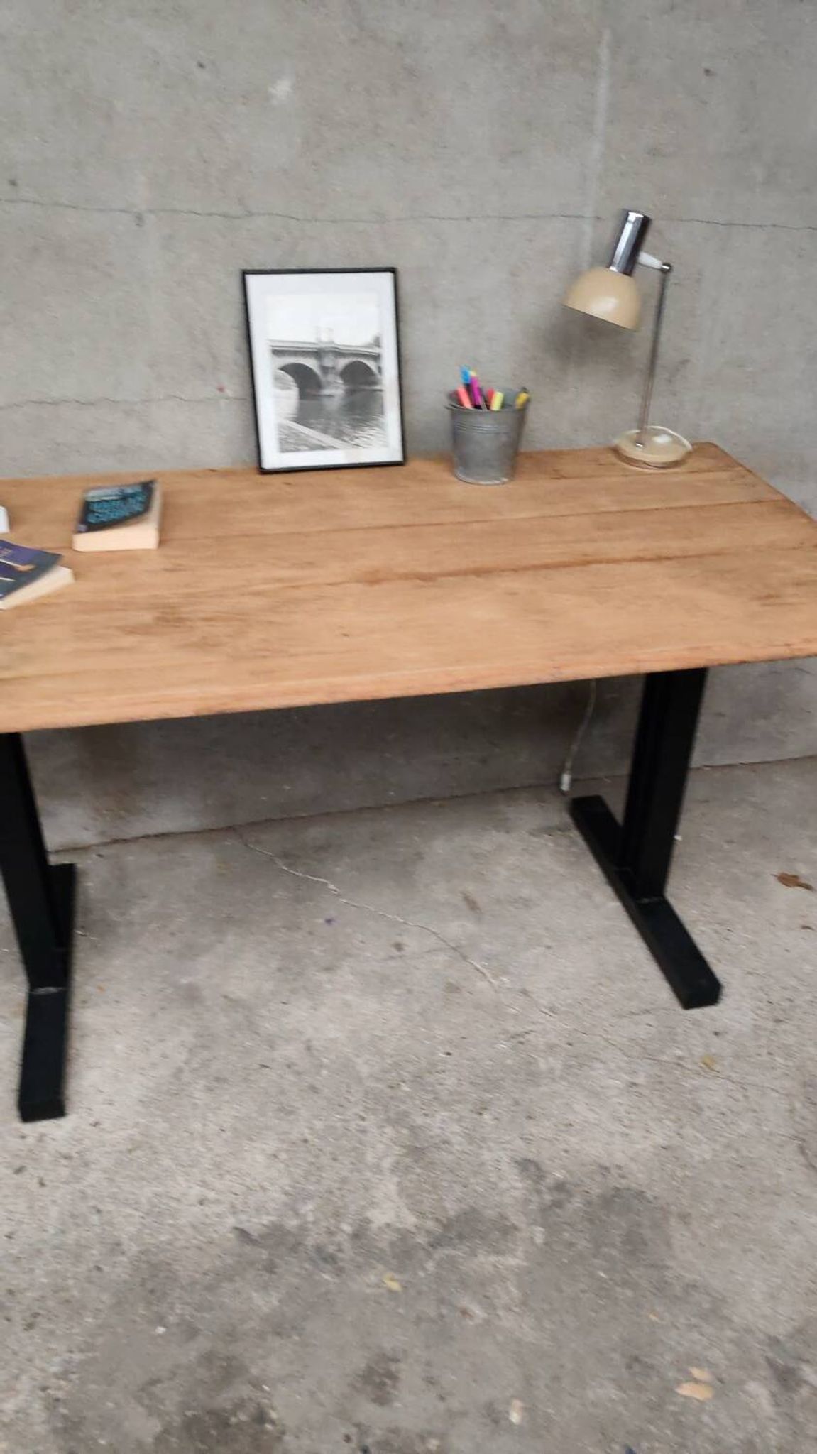 Unique wooden table with metal industrial legs.